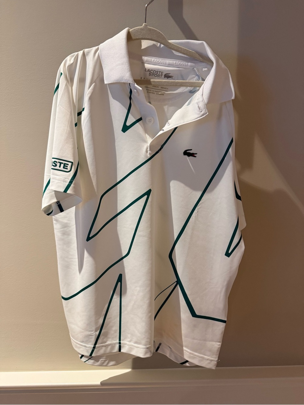 Lacoste White Polo with Green Graphic Lines
